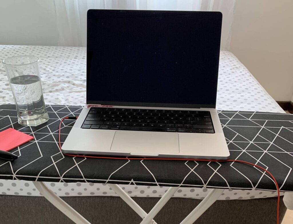 Remote work desk set up. When you work from anywhere, you may have to be flexible with your computer desk, like using an ironing board. 