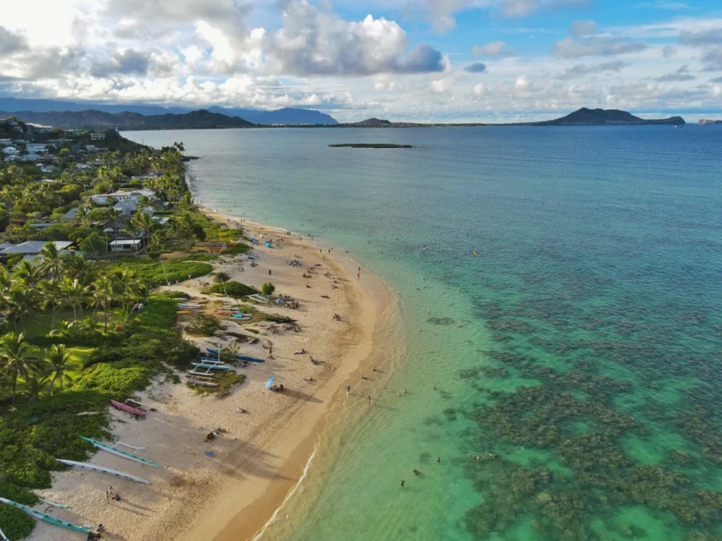 Aerial view of Lanikai Beach in Hawaii with turquoise water, sandy shore, and small waves
