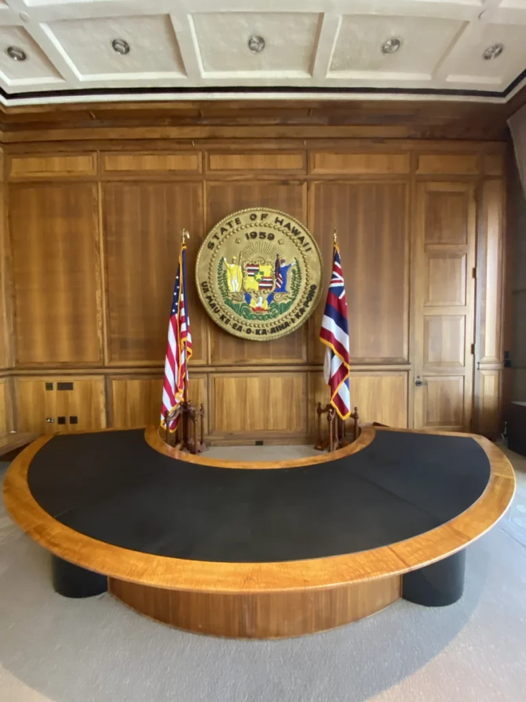 Interior of the Hawaii State Capitol office with American and Hawaii state flags