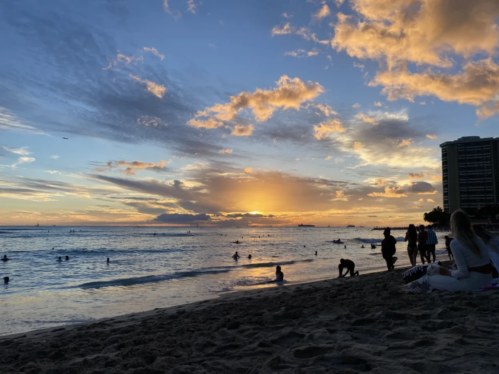 Sunset at Waikiki Beach with warm colors over the ocean